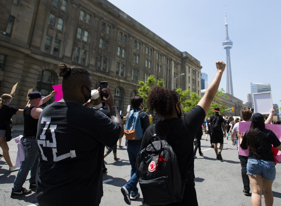 Thousands of people protest at an anti-racism demonstration reflecting anger at the police killings of black people, in Toronto on Friday, June 5, 2020. (Nathan Denette/The Canadian Press via AP)