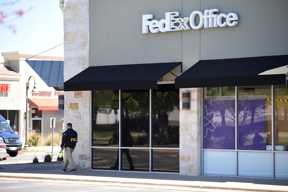 <p>Law enforcement personnel are seen outside a FedEx Store which was closed for investigation, in Austin, Texas, March 20, 2018. (Photo: Sergio Flores/Reuters) </p>