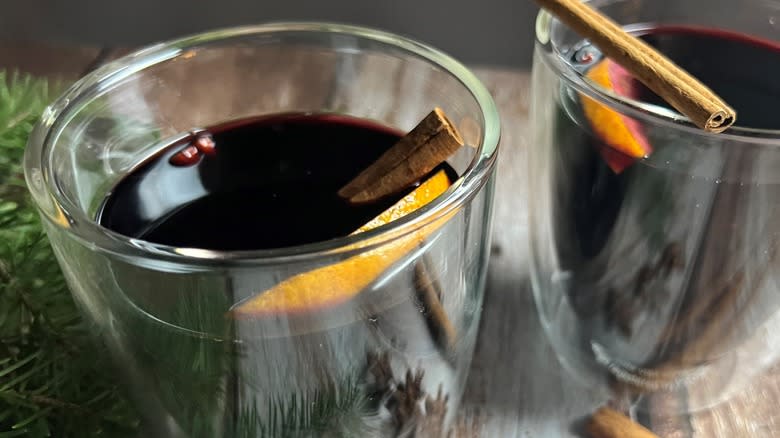 wine and cinnamon in glass mugs