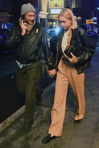 <p>JosiahW / BACKGRID</p> Bradley Cooper and Gigi Hadid leave 'Sweeney Todd' musical in New York City in March 2024.