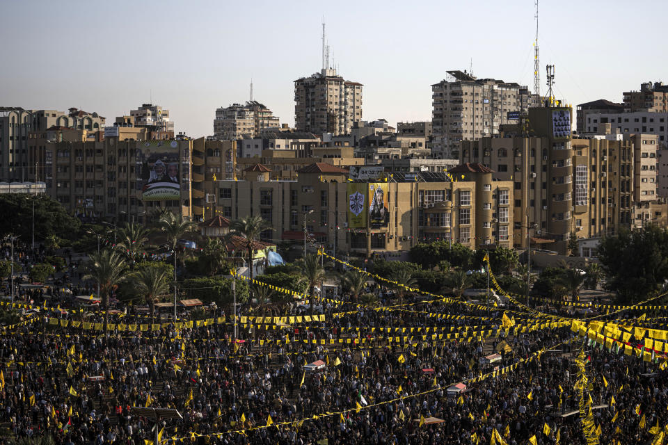 Palestinians wave yellow Fatah movement flags during a rally marking the 18th anniversary of the death of Fatah founder and Palestinian Authority leader Yasser Arafat in Gaza City, Thursday, Nov. 10, 2022. (AP Photo/Fatima Shbair)