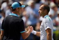 Tennis - Aegon Championships - Queen’s Club, London, Britain - June 23, 2017 Luxembourg's Gilles Muller shakes the hand of USA's Sam Querrey as he celebrates winning his quarter final match Action Images via Reuters/Tony O'Brien