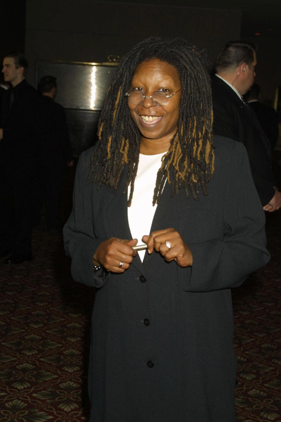 Whoopi Goldberg grinning