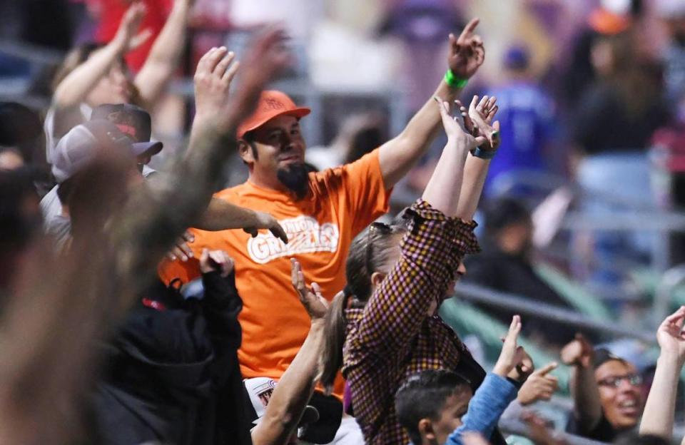 Fresno Grizzlies fans cheer the team in the 2023 season home opener against the Stockton Ports Tuesday, April 11, 2023 in Fresno.