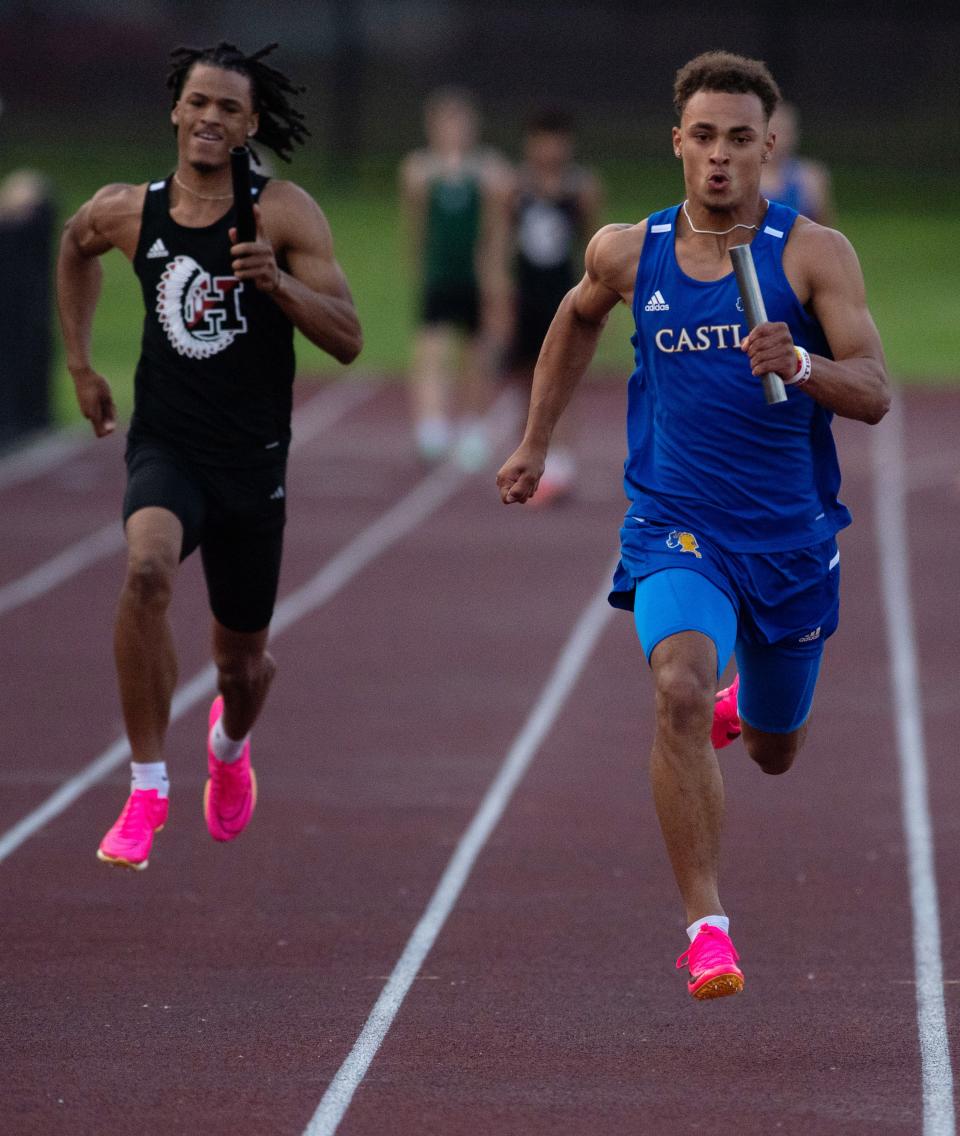 Castle's Antonio Harris, right, and Harrison's Myles Terry near the finish line in the 400 meter relay during the IHSAA Boys Sectional 32 Track and Field Meet at Central Stadium Thursday evening, May 18, 2023. Castle was first with a time of 43.33 seconds and Harrison placed second in 43.80.