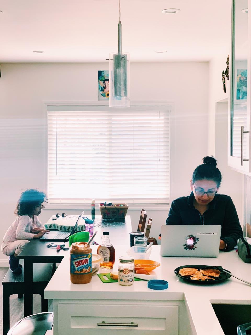 Children work on their schoolwork at home