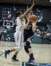 Tulane guard Kolby Morgan (3) blocks Connecticut guard/forward Katie Lou Samuelson (33) during the first half of an NCAA college basketball game in New Orleans, Saturday, Feb. 18, 2017. (AP Photo/Sophia Germer)