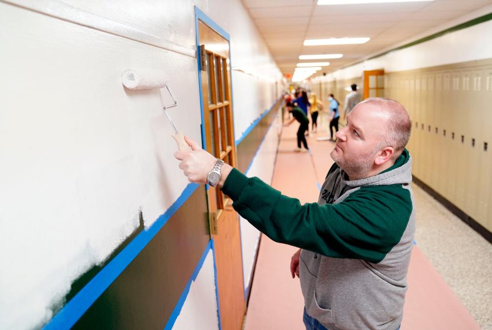 Superintendent Bracken Healy paints with students at Passaic Valley Regional High School on Thursday, March 10, 2022, in Little Falls.