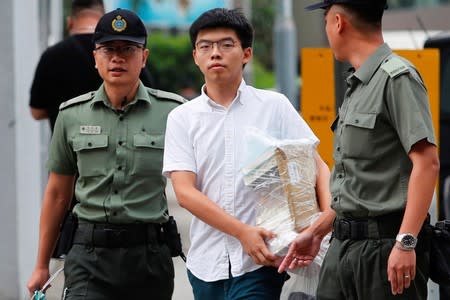 Former student leader Joshua Wong walks out from prison after being jailed for his role in the Occupy Central movement, also known as “Umbrella Movement”, in Hong Kong