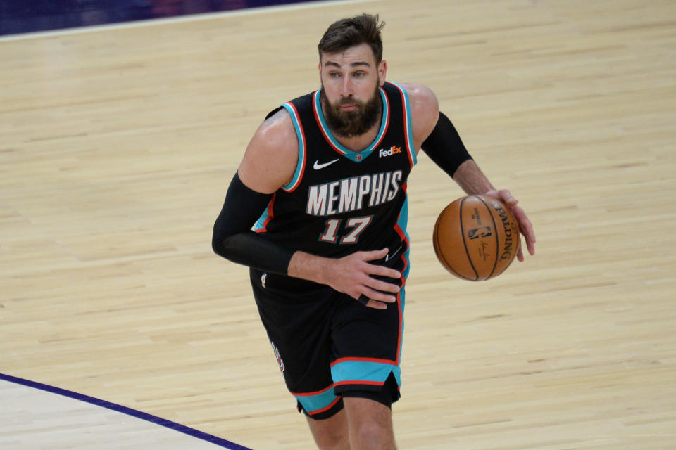 Mar 15, 2021; Phoenix, Arizona, USA; Memphis Grizzlies center Jonas Valanciunas (17) dribbles the ball against the Phoenix Suns during the second half at Phoenix Suns Arena. 