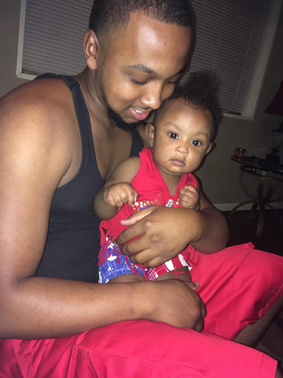 Jermaine Jones, 24, with his daughter, Alanah Jones. Jones is in a coma after being hit with a stun gun and involved in a struggle with Richmond County Sheriff's deputies.