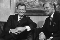 <p>West German Chancellor Helmut Schmidt, right, responds to newsmen “I hope you are all in good humor, if not, you can have some of ours,” prior to his talks with Zbigniew Brzezinski, Pres. Jimmy Carters national security adviser, Tuesday, Oct. 3, 1978, Bonn, Germany. (Photo: Klaus Schlagmann/AP) </p>