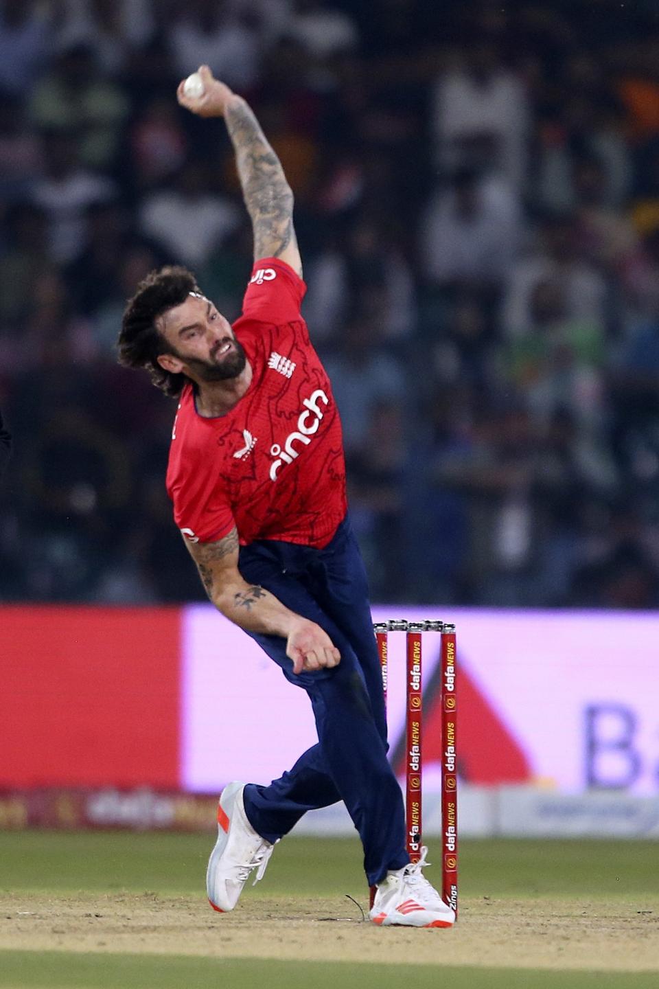 England's Reece Topley bowls during the seventh twenty20 cricket match between Pakistan and England, in Lahore, Pakistan, Sunday, Oct. 2, 2022. (AP Photo/K.M. Chaudary)