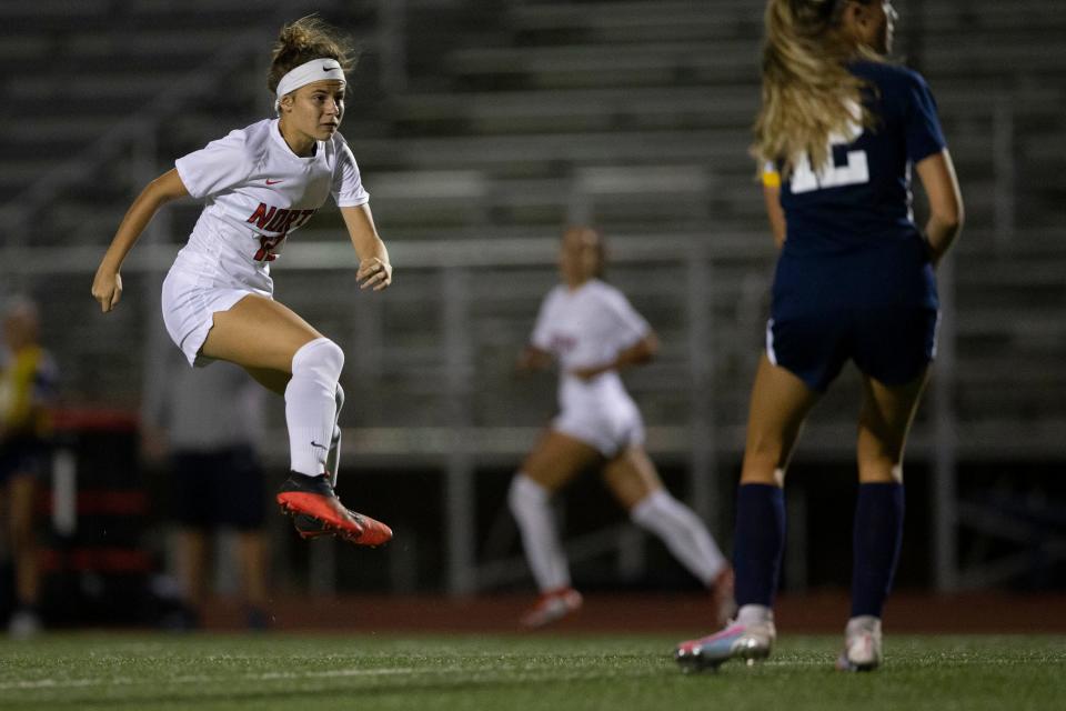 North Fort Myers' Sophia Kerns (12) takes a shot during a varsity girl’s high school soccer match between North Fort Myers and Naples, Tuesday, Nov. 9, 2021, at Naples High School in Naples, Fla.North Fort Myers defeated Naples 1-0.