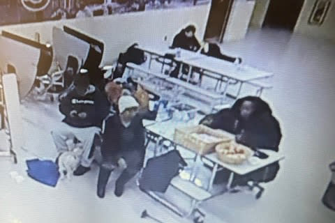 Surveillance video shows people caught in the storm taking shelter at the Pine Hill School in Cheektowaga, N.Y. (via Cheektowaga Police Dept. )