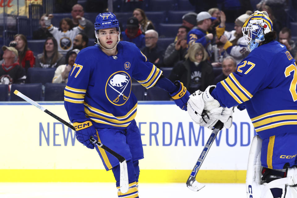 Buffalo Sabres right wing JJ Peterka (77) celebrates his goal with goaltender Devon Levi (27) during the second period of an NHL hockey game against the Ottawa Senators Wednesday, March 27, 2024, in Buffalo, N.Y. (AP Photo/Jeffrey T. Barnes)