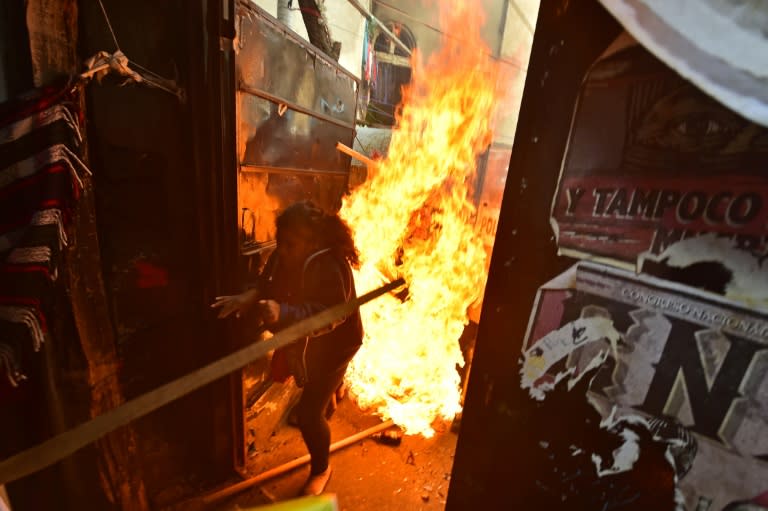 Mexican riot police clash with residents of an indigenous camp as they are evicted from the improvised homes where many had been living for years in Mexico City