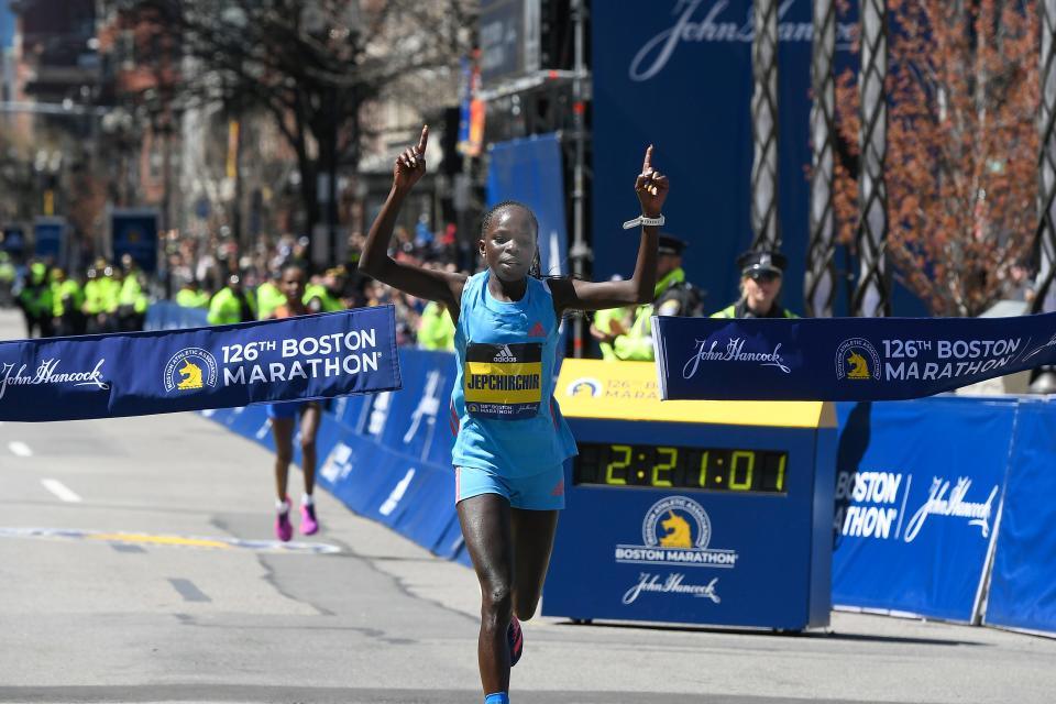 Peres Jepchirchir crosses the finish line to win the women’s division.