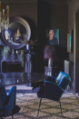 <p>"I’ve kept the palette quite restrained in this area, which means I can easily mix 1950s blue Italian chairs, with super large raffia lamps, supersized mirrors and twinkly chandeliers."</p>