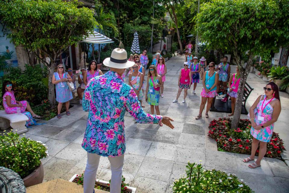 Women in Palm Beach for The Pink Retreat take Rick Rose's popular tour of Worth Avenue, which explores Worth Avenue's origins, unique architecture, legendary landmarks and some of its famous residents in June 2023.