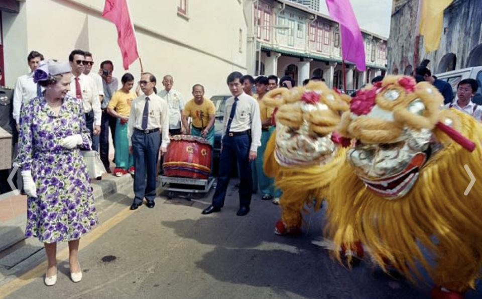 Queen Elizabeth II looks at a lion dance performance in Tanjong Pagar on 10 October 1989.