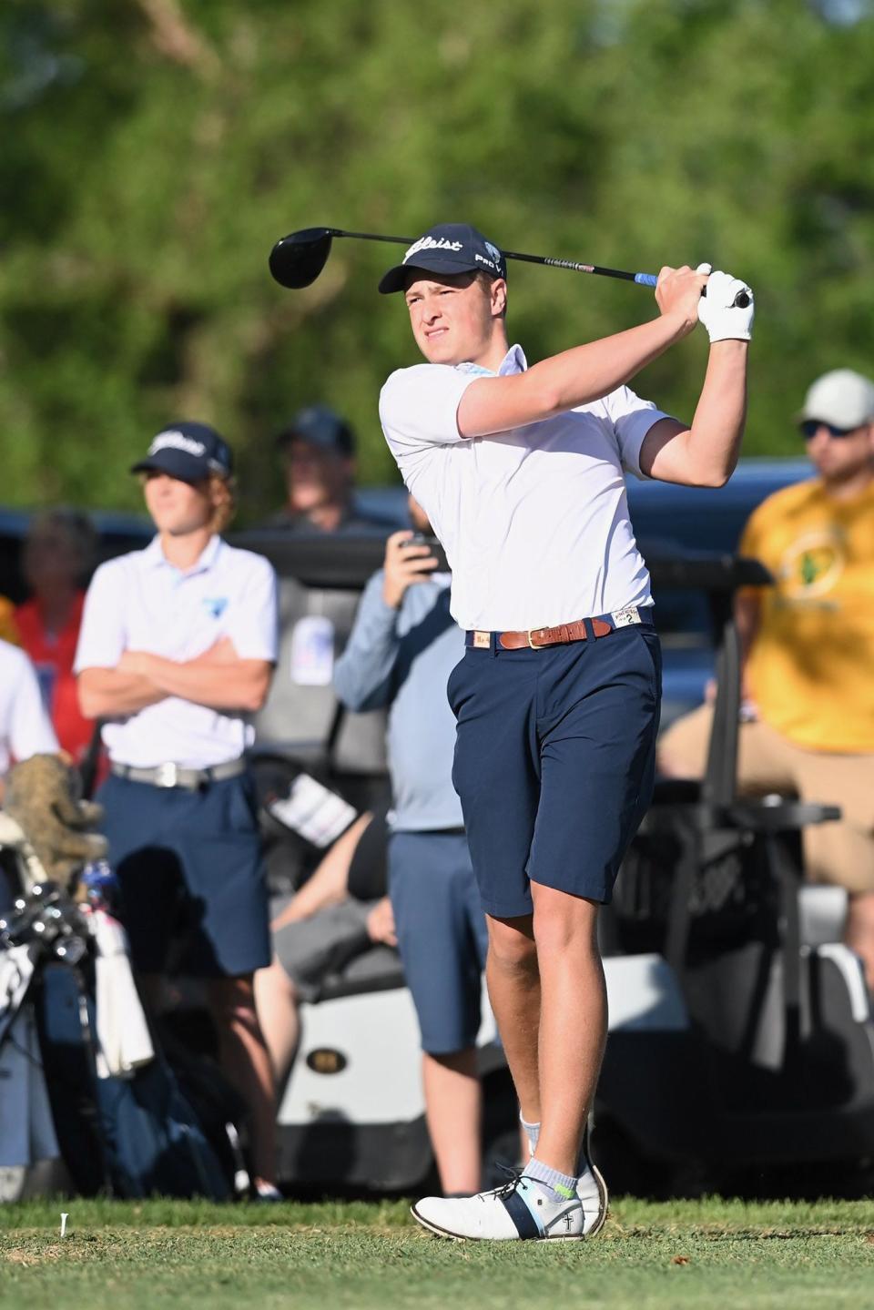 Father Tolton's Christian Rischer swings during the Class 3 state golf championships in Sedalia.