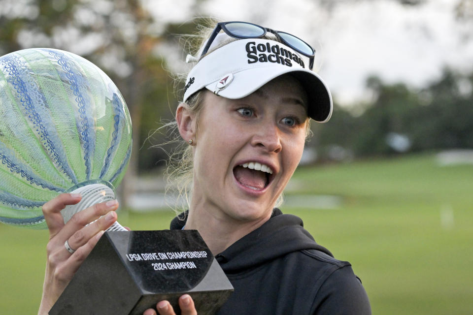 Nelly Korda holds the championship trophy after winning the LPGA Drive On Championship golf tournament at Bradenton Country Club, Sunday, Jan. 28, 2024, in Bradenton, Fla. (AP Photo/Steve Nesius)