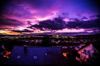 December 22: Hurricane Xaver by Vinc Weiss. 'Hurricane 'Xaver' was due to hit Germany at any moment. When I parked my car on the roof of the car park this awesome view greeted me. I took my camera and photographed it. What makes it so special for me is the mix of the upcoming storm with the wild clouds and the beautiful sunset combined with the view on the famous university hospital center of Tuebingen.'