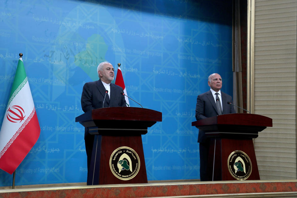 Iraqi Foreign Minister Fouad Hussein, right, and visiting Iranian Foreign Minister Mohammad Javad Zarif hold a news conference following their meeting in Baghdad, Iraq, Monday, April 26, 2021. (AP Photo/Khalid Mohammed)