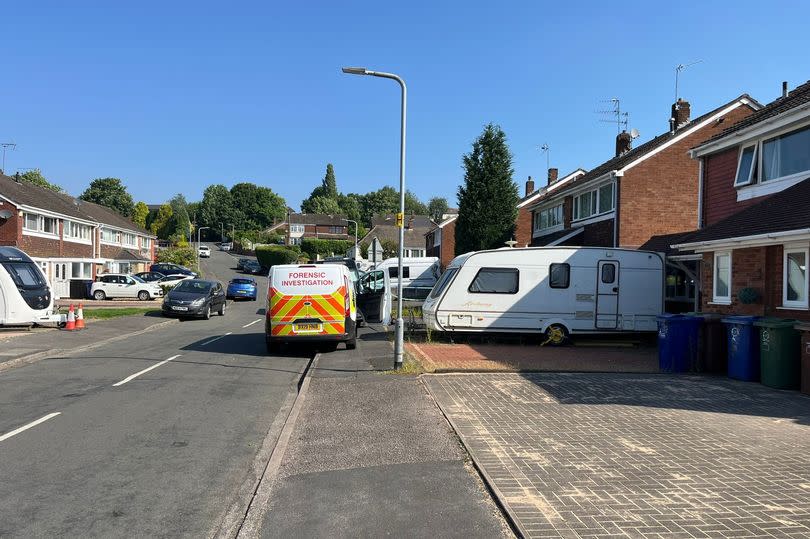 A forensic police van at the scene