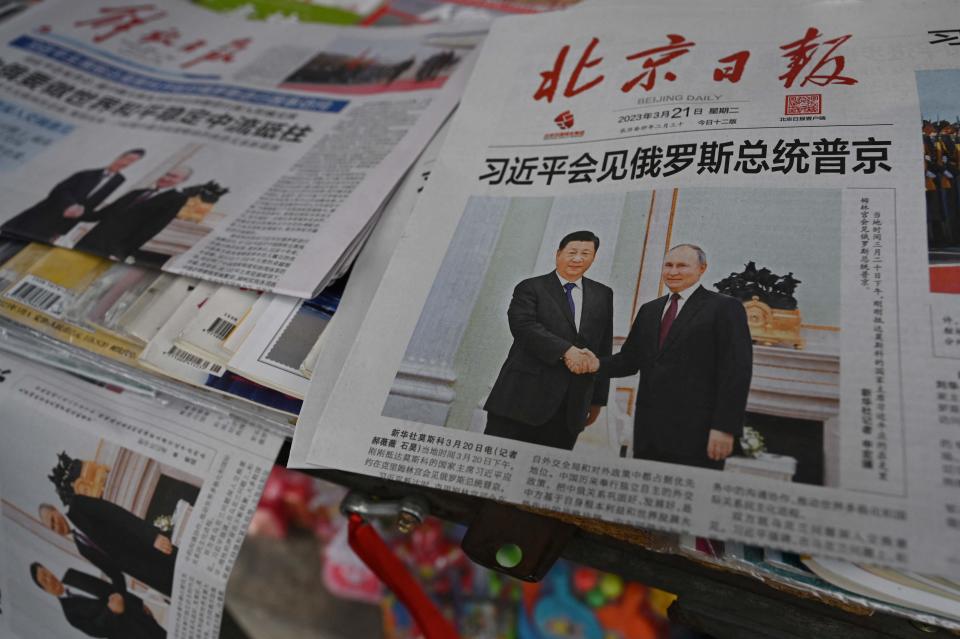 Newspapers featuring a front page photo of the two leaders, at a newsstand in Beijing (AFP/Getty)