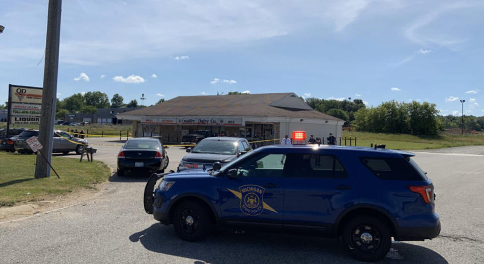 Officers with the Michigan State Police and Eaton County Sheriff's Department respond to a stabbing incident at a Quality Dairy store in Delta Township, Mich., on July 14, 2020. (Michigan State Police Lansing)
