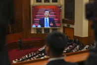 Chinese President Xi Jinping is seen on a screen during the second plenary session meeting of the National People's Congress (NPC) in the Great Hall of the People in Beijing, China, Friday, March 8, 2024. (AP Photo/Tatan Syuflana).