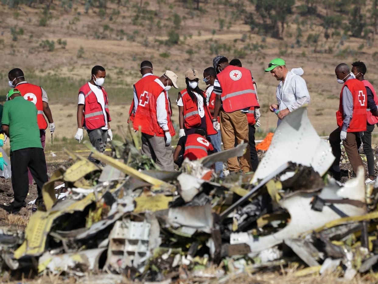 Forensics investigators and recovery teams at the crash site of Ethiopian Airlines Flight ET 302 on 12 March 2019 in Bishoftu, Ethiopia: Getty