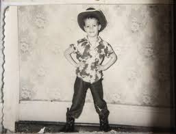 David Burkauzer Bauer posed in his cowboy outfit before his parents separated and he and his sisters were abandoned in a New Jersey orphanage.