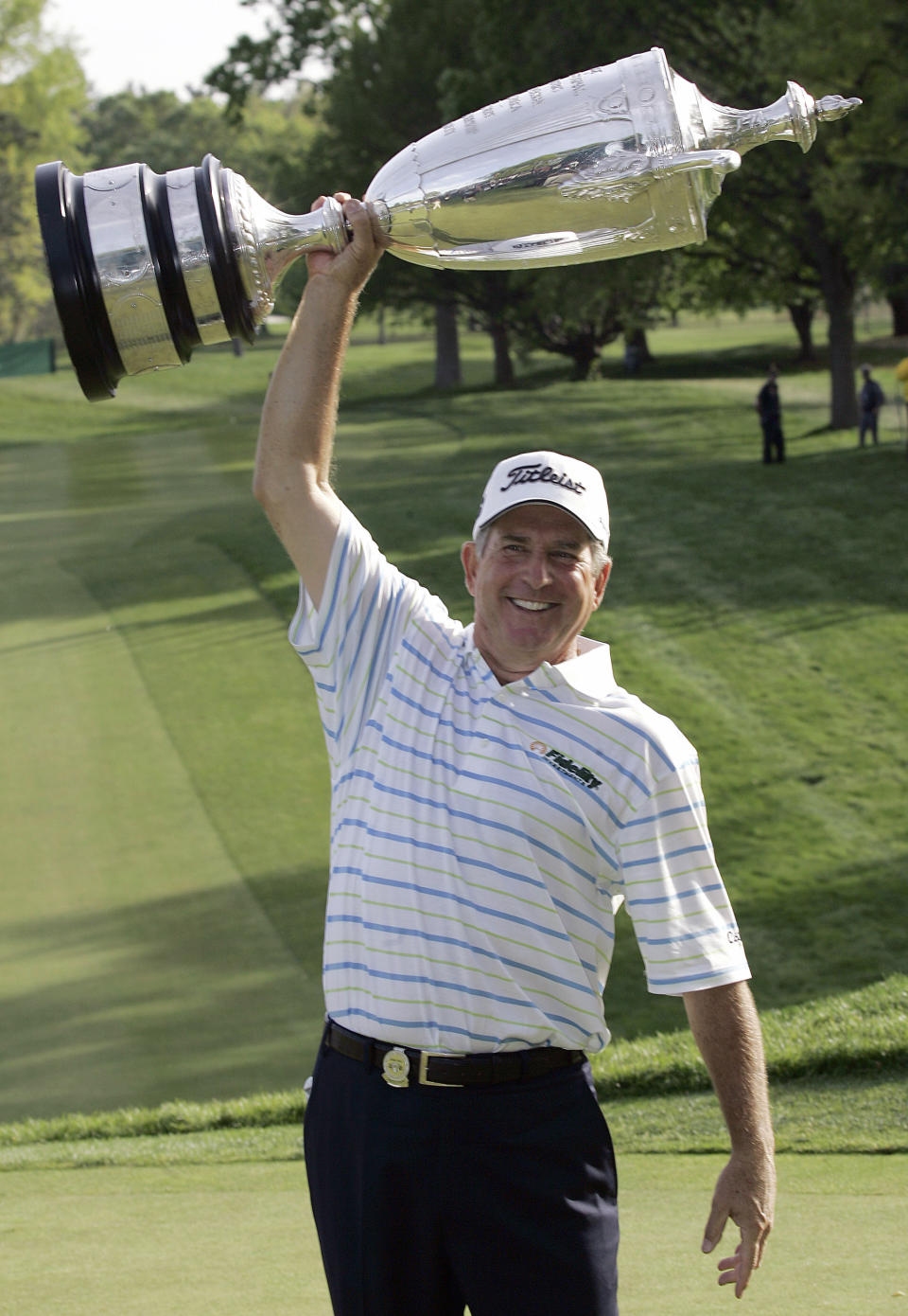 FILE - In this May 25, 2008, file photo, Jay Haas holds up the trophy and celebrates winning the Senior PGA Championship golf tournament at Oak Hill Country Club in Rochester, N.Y. It didn't take long for Haas to be reminded of how gusting winds can play havoc on those making their way around Oak Hill Country Club's East Course. "Got here on Sunday night and played nine holes Monday, and it was blowing, what, 25, 30 (miles per hour)," Haas recalled with a laugh Wednesday, May 22, 2019, a day before the Senior PGA Championship opens. (AP Photo/David Duprey, File)