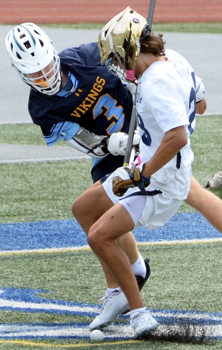 Luke Burton of Cape Henlopen jars ball lose from Ben Anton of Salesianum during the 2023 DIAA Boys Lacrosse championship game.