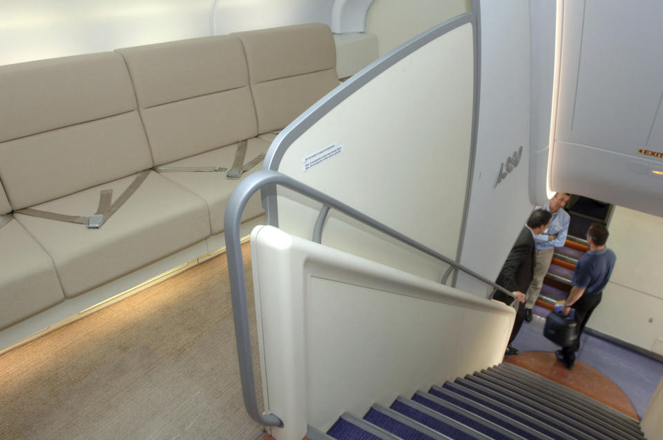 FILE- In this Nov. 13, 2007, file photo a lounge area await guests in the second floor business class of passenger plane, the Airbus A380, that landed at Orlando International Airport on a test flight and world tour in Orlando, Fla. European plane maker Airbus said Thursday, Feb. 14, 2019, that it will stop making its superjumbo A380 in 2021 for lack of customers, abandoning the world's biggest passenger jet and one of the aviation industry's most ambitious and most troubled endeavors. (AP Photo/Phelan M. Ebenhack, File)