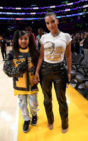 Kevork Djansezian/Getty North West and Kim Kardashian attend Friday's Los Angeles Lakers playoff match-up