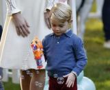 Britain's Prince George plays with a bubble gun at a children's party at Government House in Victoria, British Columbia, Canada, September 29, 2016. REUTERS/Chris Wattie