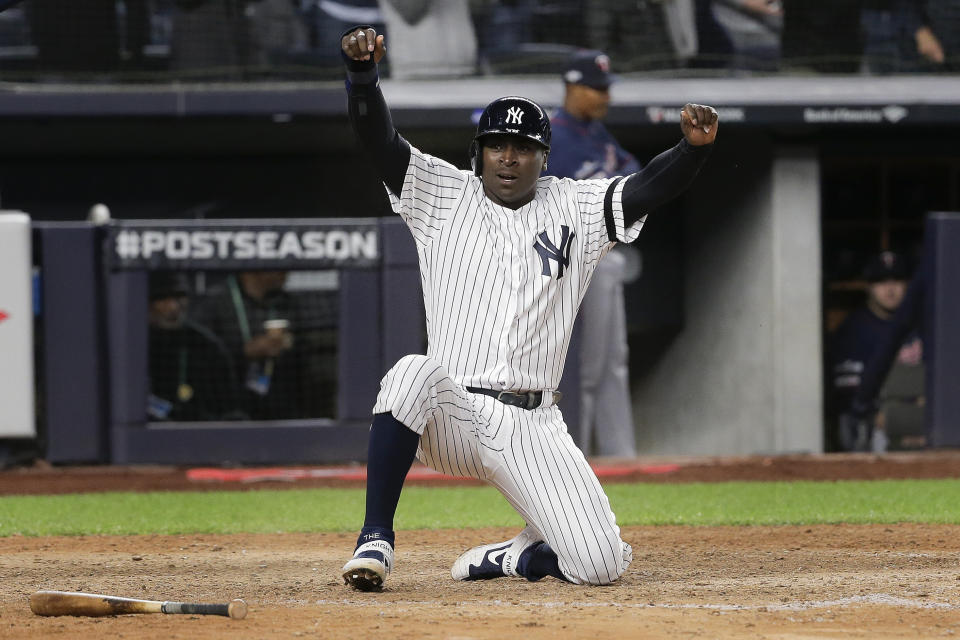 New York Yankees' Didi Gregorius reacts after scoring on a double by second baseman DJ LeMahieu (26) during the seventh inning of Game 1 of an American League Division Series baseball game against the Minnesota Twins, Friday, Oct. 4, 2019, in New York. (AP Photo/Seth Wenig)
