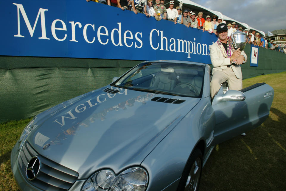 Ernie Els poses wiht a Mercedes SL500 after winning the 2003 Mercedes Championship at the Plantation Course at Kapalua in Hawaii. (Photo: Donald Miralle/Getty Images)