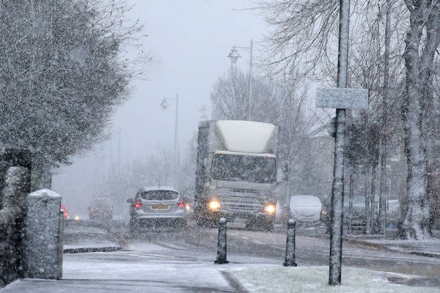 Vehicles driving down Dumbarton Road in Stirling during a snow blizzard, as a cold weather front is to sweep in with temperatures expected to drop as much as 10C to below zero overnight into Thursday.