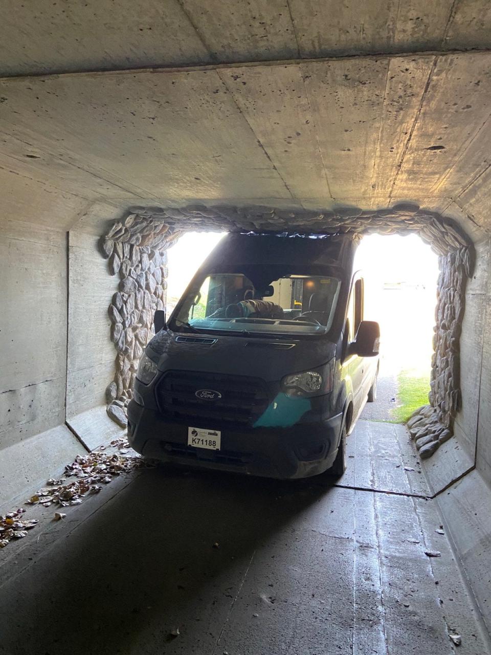 A photo taken by Bill Offer shows an Amazon truck stuck in a golf cart tunnel about 2:30 p.m. Nov. 7, 2020, at the Boulder Pointe Golf Club in Oxford, Mich.