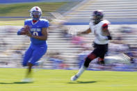 Tennessee State quarterback Deveon Bryant, left, scrambles from Southeast Missouri State linebacker Omardrick Douglas during an NCAA college football game Sunday, April 11, 2021, in Nashville, Tenn. Because of COVID-19, the OVC postponed the 2020 season to the spring, and the decision was made to play games on Sunday because member schools needed flexibility to staff all the spring sports. (AP Photo/Mark Humphrey)