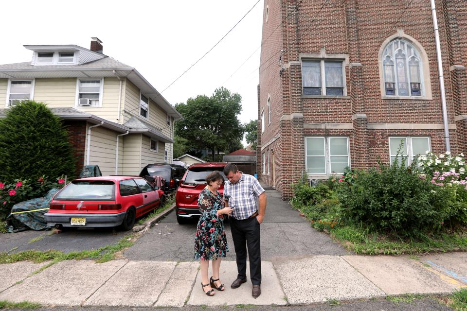 Olha and Serhiy step out of church to receive a call from their son, Igor, who left New Jersey in February to help Ukraine.  They were unable to get in contact with him on this day, but they were able to reach him the next day.  Sunday, July 31, 2022.