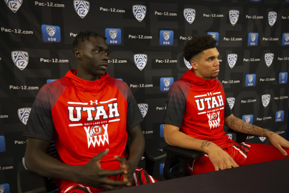 Utah's Both Gach, left, and Timmy Allen speak during the Pac-12 NCAA college basketball media day Tuesday, Oct. 8, 2019 in San Francisco. (AP Photo/D. Ross Cameron)