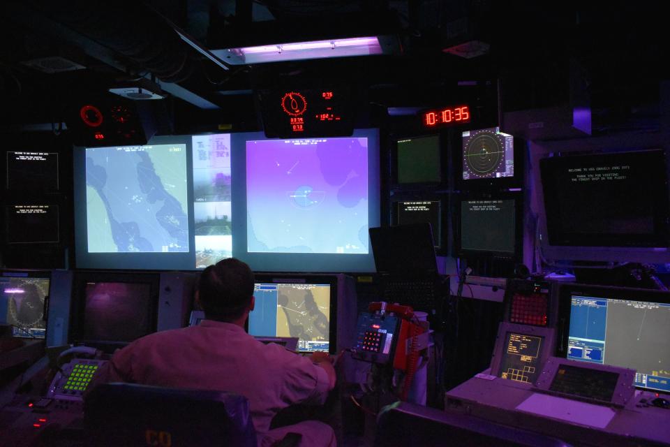 The combat information center aboard the USS Gravely.