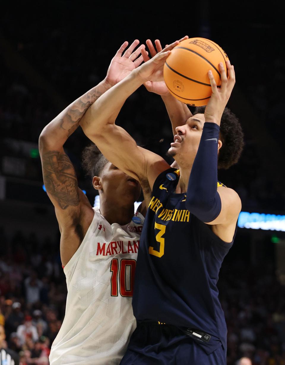 West Virginia Mountaineers forward Tre Mitchell (3) shoots against Maryland Terrapins forward Julian Reese (10) during the second half in the first round of the 2023 NCAA Tournament at Legacy Arena on Mar 16, 2023 in Birmingham, AL.