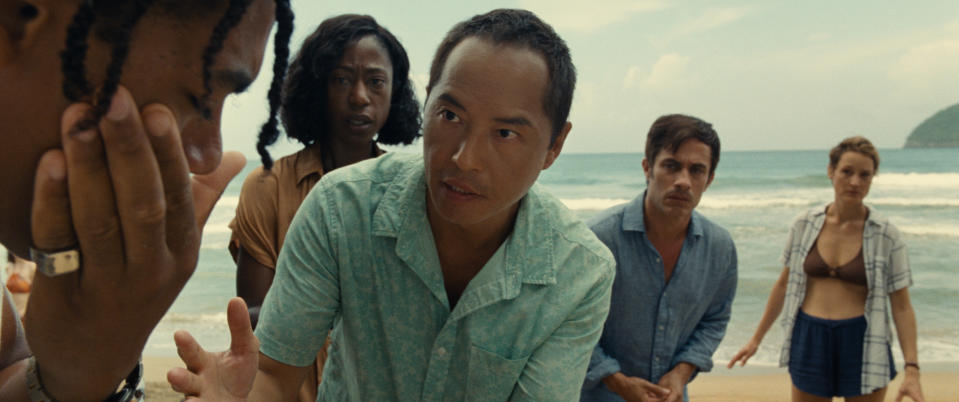 (L-R) Mid-Sized Sedan (Aaron Pierre), Patricia (Nikki Amuka-Bird), Jarin (Ken Leung), Guy (Gael García Bernal) and Prisca (Vicky Krieps) in “Old” - Credit: Universal